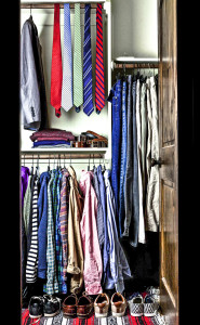 A man's closet prior to packing for Paris.