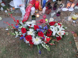Blue, white and red flowers adorn the memorial at the French Embassy in D.C.