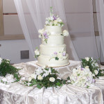 A beautiful cake atop a beautiful table.