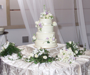 A beautiful cake atop a beautiful table.